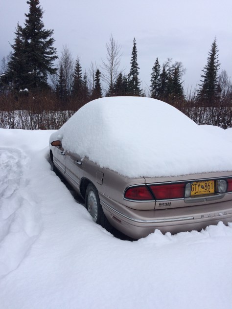 Papa Freds car parked at the trail head covered in snow